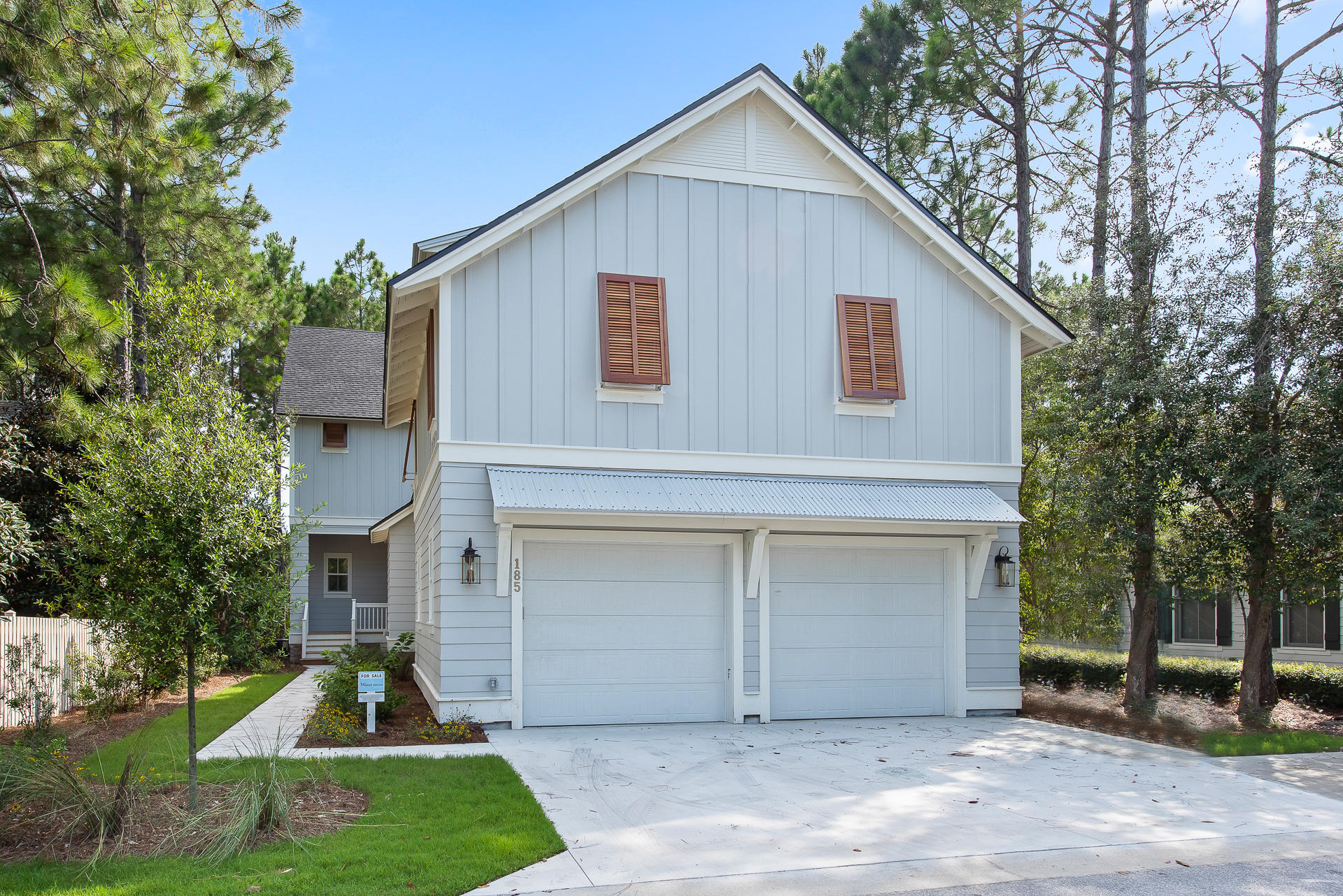 Located in picturesque Watersound Origins, this beautiful new build features hardwood floors, an open layout, and tons of natural light. The floorplan offers high ceilings in main areas, shiplap walls, open and bright living/dining layout with plenty of windows, a gourmet kitchen with beautiful countertops and a stainless steel vent hood, a large screened-in back porch, and a chandelier in the dining room. The dining room features plenty of light and a custom chandelier with views of the back yard and deck. The living room offers an open concept plan, tons of natural light and plenty of space to spread out and enjoy time with the family. Also, enjoy the five bedrooms and six bathrooms, which offers lots of space for family to gather.