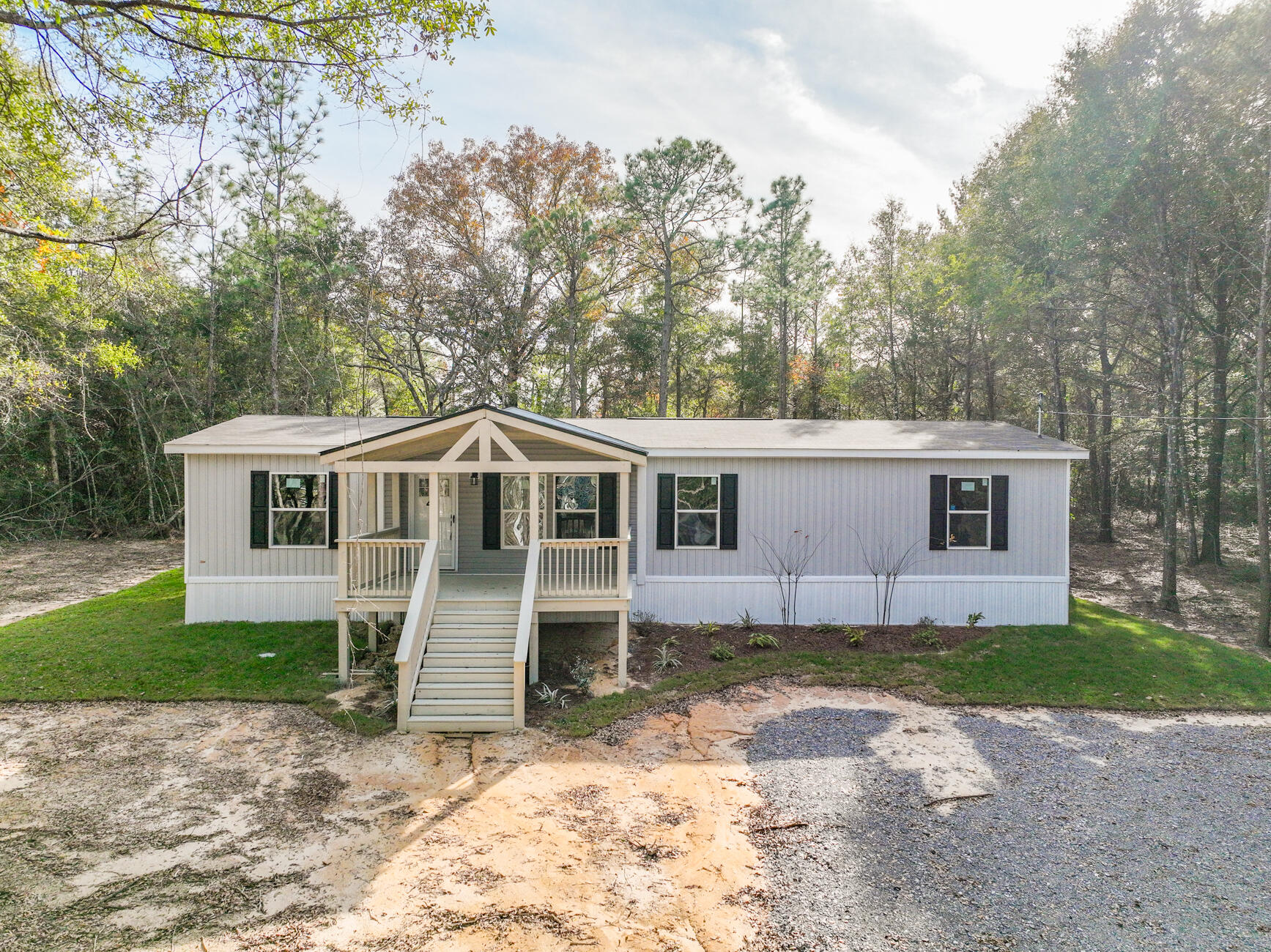 Welcome to Turkey Creek Woodlands! Seller is offering up to $5,000 towards buyer closing costs! Home warranty is included! The lots are over 1 ACRE! A large custom covered porch adorns this NEW 2023 Clayton Expedition home! The home perfectly combines elegance and functionality. This 4/2 top-of-the-line home comes with a modern, open-concept floor plan boasting 1,580 square feet of living space. This home was designed for comfort and convenience, built with the highest-quality materials and meets strict energy-efficient standards. Features include Duracraft cabinetry, Frigidaire appliances and Shaw(r) Laminate Flooring. Save thousands on utility bills with a well and septic tank! Conveniently located within 30 minutes to most of the military bases and Crestview/DeFuniak! Call today!
