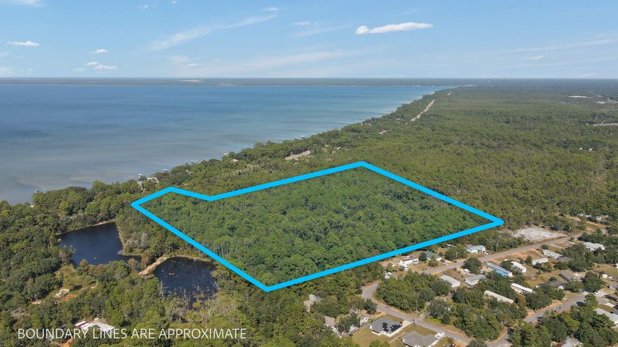 Property is located across the street from East Bay! Property is Zoned R-1 and in flood zone X.  This tract is a in a prime area to build a subdivision or to own piece of paradise.  This Navarre/Gulf Breeze area is one of the fastest growing in the whole panhandle of Florida.