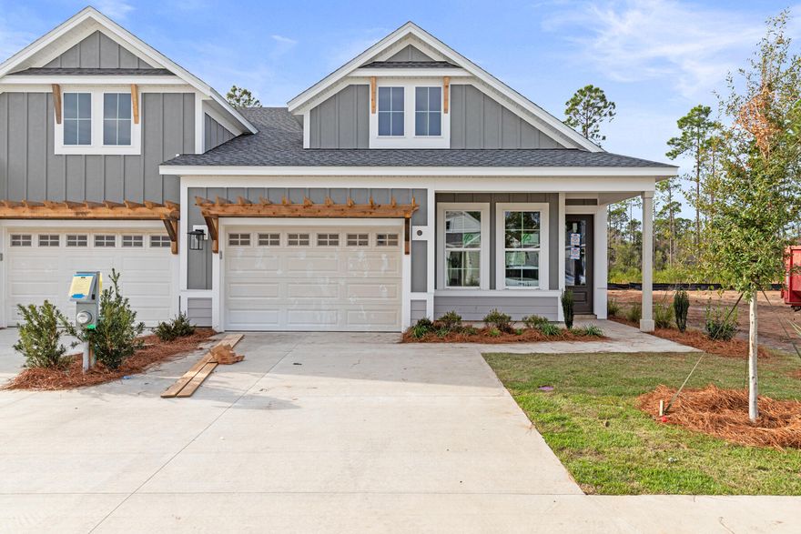 ** Seller closing cost incentive for this Market Home** This thoughtfully crafted 2-bedroom, 2-bathroom paired patio villa with 1,418 square feet and a 1.5-car garage offers easy, single-level living with modern finishes and a bright, open layout. The LUCAS floor plan by Fischer Homes welcomes you from the foyer into the connected kitchen, dining, and family room, all opening to a covered rear patio with peaceful wooded views.The upgraded kitchen is appointed with quartz countertops, under-cabinet lighting, a farmhouse sink, soft-close cabinetry, a beautiful glazed pearl ceramic tile backsplash, and a pantry for added storage. An enhanced stainless steel appliance package includes a 30inch gas 5-burner cooktop, vented canopy hood, and a built-in 30inch microwave/oven combination.

The owner's suite features a generous bedroom, an oversized walk-in closet, and a private bath with a tiled walk-in shower with frameless glass doors, quartz vanity, and raised-height cabinetry. A second bedroom and full bath near the front of the home offer versatility for guests or an office setup.

Additional interior upgrades include 10' ceilings, 8' doors, luxury vinyl plank flooring, a SmartCode touchscreen entry, and an installed Smart Home package for added convenience. Energy-conscious construction features impact-rated windows, LED lighting, and a tankless gas water heater. A family foyer/drop zone and inviting front porch complete the home's practical layout.

Estimated completion: December 2025.
Designer selections can be viewed in the Documents section.

Residents enjoy low-maintenance living with HOA-covered lawn care and exterior upkeep, along with access to the exceptional Watersound Origins amenities.
