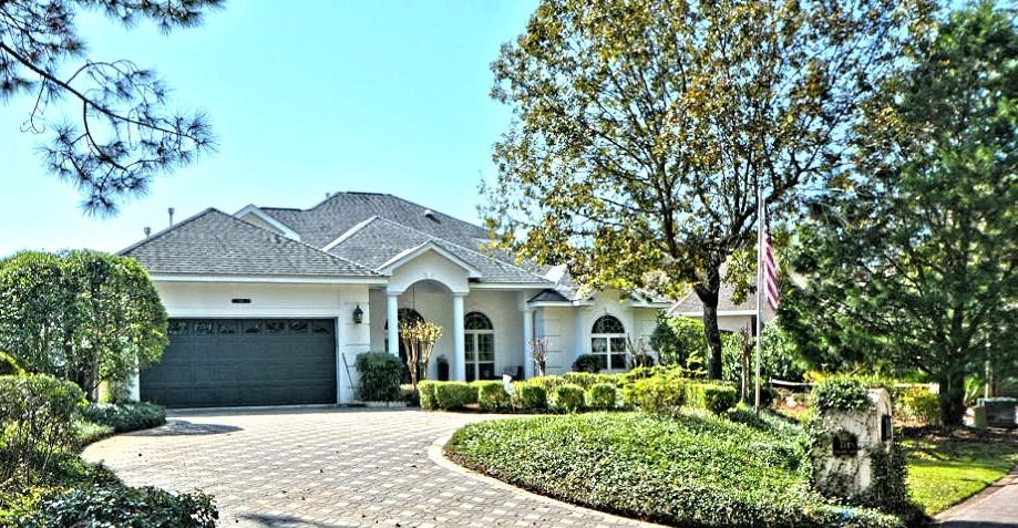 Stunning lakefront home in the heart of Bluewater Bay. This home is located in a cul-de-sac giving the home added privacy and security. Fantastic floor plan with a main floor master, library/office and two additional bedrooms upstairs. Large Master Suite has two Walk-In Closets, Sitting Area, Dual Vanities, Jacuzzi Tub and Large Separate Shower. Custom kitchen with Stainless Appliances, Granite Countertops, Breakfast Bar & Nook, and incredible lake views. Additional features include a New Roof - 2017, Wicander Flooring in Master Suite, Dual A/C systems, Brick Paved Driveway, Custom Cabinetry in Master Bedroom/Living Rm/Library, Gas Fireplace, Custom Blinds, Crown Molding, Cat 5 Wiring, Surround Sound and Security System, Seawall, Sundeck, Screened-in Pool with Jet Stream and Fountain.