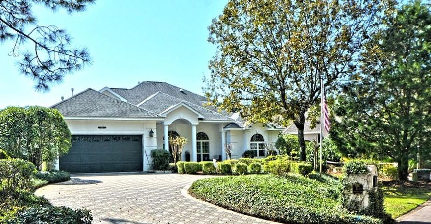 Stunning lakefront home in the heart of Bluewater Bay. This home is located in a cul-de-sac giving the home added privacy and security. Fantastic floor plan with a main floor master, library/office and two additional bedrooms upstairs. Large Master Suite has two Walk-In Closets, Sitting Area, Dual Vanities, Jacuzzi Tub and Large Separate Shower. Custom kitchen with Stainless Appliances, Granite Countertops, Breakfast Bar & Nook, and incredible lake views. Additional features include a New Roof - 2017, Wicander Flooring in Master Suite, Dual A/C systems, Brick Paved Driveway, Custom Cabinetry in Master Bedroom/Living Rm/Library, Gas Fireplace, Custom Blinds, Crown Molding, Cat 5 Wiring, Surround Sound and Security System, Seawall, Sundeck, Screened-in Pool with Jet Stream and Fountain.