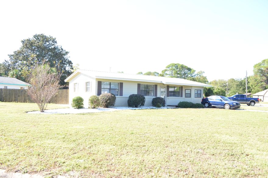 This wonderfully maintained and upgraded home is located on a large corner lot in the Southern part of Fort Walton Beach and is just minutes away from downtown shopping, numerous restaurants and parks. Your new home kitchen upgrades include cabinets with frosted glass, corian counter tops, tiled back splash and pantry. Additional upgrades include new metal roof June 2017 and new HVAC system a couple of years ago. The lovely bathroom has a shower/tub combo with tile surround, pedestal sink and tile floors. The spacious master bedroom has a bay window and walk in closet. There is a very large detached garage in the back along with a brand new 2nd driveway leading to back yard. There are French doors that lead onto an open 16x16 deck with all new boards.