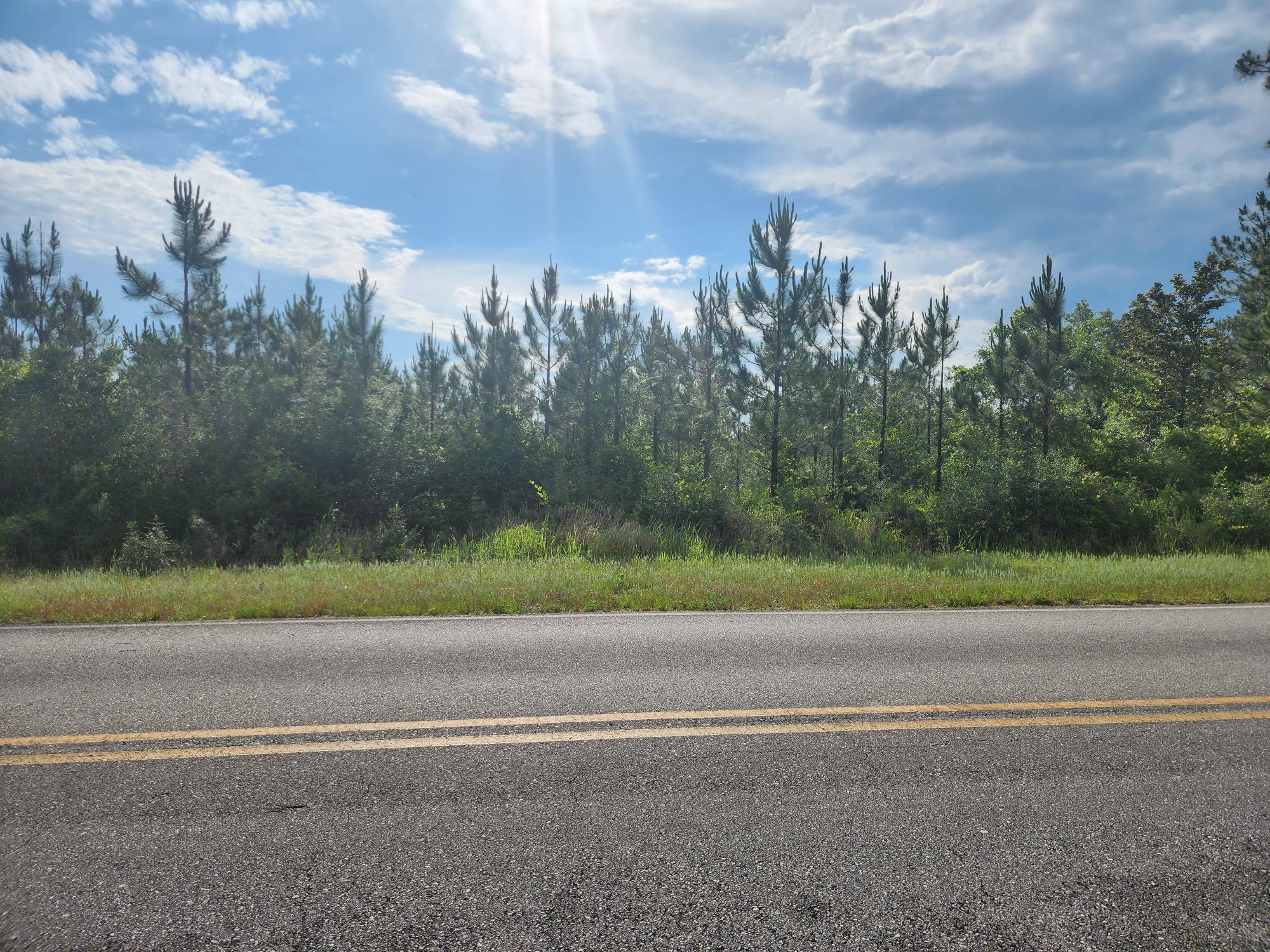 Beautiful property in Laurel Hill, bring your house plans and build that barndominium while you enjoy the serentity of the country setting without being too far out form town.