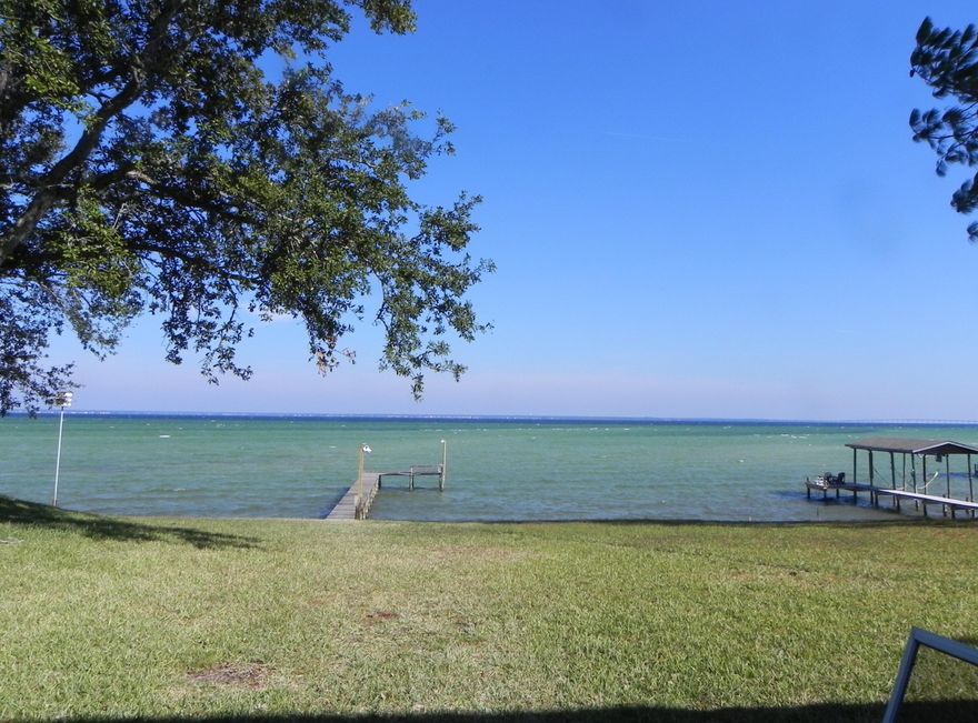 Superbly Remodeled Executive home, 100 feet on the Bay just under an acre with dock, boatlift and seawall in the heart of Destin! Over $130,000 in extensive renovations has turned this into a one of kind, must see home designed for enjoying every aspect of the beauty and serenity of the Bay and Inter-coastal Waterway. No detail was left undone, to include kitchen and baths, fogged windows, flooring, textured ceilings, hot tub with screened in porch, painting, landscaping and so, so much more. There's a huge laundry room and 2 car garage and additional parking for entertaining friends and family. All that's missing is you. Schedule your private tour today and start living the waterfront, Destin lifestyle you've always dreamed of and so deserve!