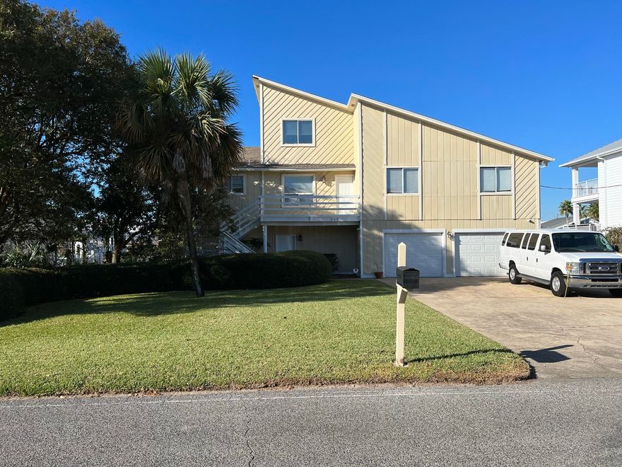 Want a great view, amazing access and fantastic location? Look no further! Bring your big boat and few small ones too! This is home is perfect for the avid fisherman, water lover or tranquility seeker. This property is on the canal with an easy route to the harbor or the gulf. This home has 4 bedrooms and 3 full baths and a spacious kitchen/dining area. There is a beautiful porch and with an outdoor kitchen with great views of  the canal. There are 2 covered boat slips with a boat lift as well as another boat lift and a dock with space to tie up other water craft. Enjoy the upper deck with a nice walk out to the canal and incredible views of the harbor. Here is your chance to live on Holiday Isle on the water. Call today for your viewing and get your slice of heaven on Earth!