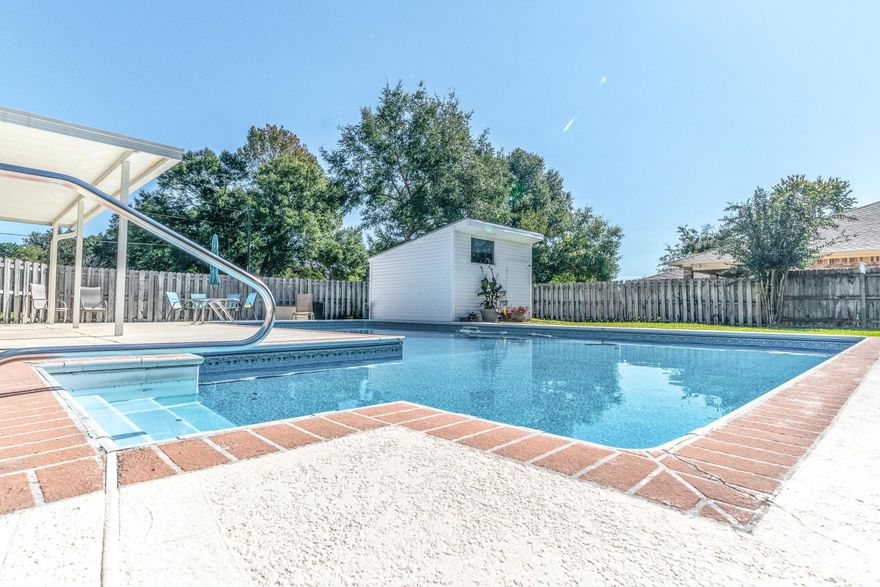 Phenomenal pool home, centrally located in Shalimar, on a large corner lot! This home has upgraded tile flooring, 2 living rooms, one with a picture window allowing ample natural light in and the other living space has wonderful built in shelving flanking the brick fireplace - a perfect space for holidays. The home offers a split floor plan with master off one side and two bedrooms and hall bath on the opposite side of the home. The home was built for entertaining, either by sitting on the enclosed sun porch or outside enjoying the beautiful fenced in sodded backyard with glorious deep pool. There is ample painted concrete decking great for sunbathing and play space. There is also a pool house for storage! There is even an outdoor grill plumbed with gas for easy barbecuing and grilling. Back inside situated between the two living rooms is a beautiful open kitchen with stainless steel appliances (fridge 2018) the kitchen window overlooks the sun room and pool. 

The over sized garage currently is being used as a separate finished room; however, the seller is willing to remove (at their cost) the rooms walls so you can enjoy the full 2 car garage should that work better for your personal use.

There are many upgrades to include: Windows, HVAC, Hot water heater, pool liner, flooring, lighting and hall bathroom updates.