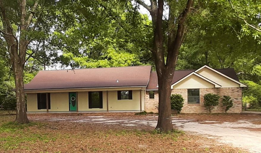 3 bedroom 2 and 1/2 bath brick home on a shaded 1 acre of land.   A total of 3004 Square Feet under roof with 1816 heated and cooled.This home features a huge family room with woodburning fireplace, newly renovated Kitchen with quartz counter tops and new appliances. This home has been updated nicely with new flooring and quartz counter tops. Main bedroom and bathroom feature double vanity, soaking tub with seperate toilet and shower, 2 clothes closets, and linen closet. Spare bedrooms share a jack-n-jill bathroom and each have generously sized clothes closets. 1/2 bath is conveniently located off of the 2 car garage and next to the kitchen and laundry area. Huge shaded back yard with tons of room to spread out. With a brand new roof, HVAC and water heater, this home is ready to go!