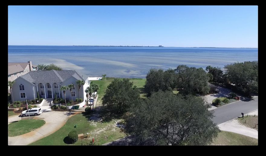 Build your dream home on this lot with EXTRAORDINARY BAY VIEWS. Large lot for estate sized home. The Bluffs at Shalimar Pointe. Enjoy gated access with golf, tennis, & clubhouse.