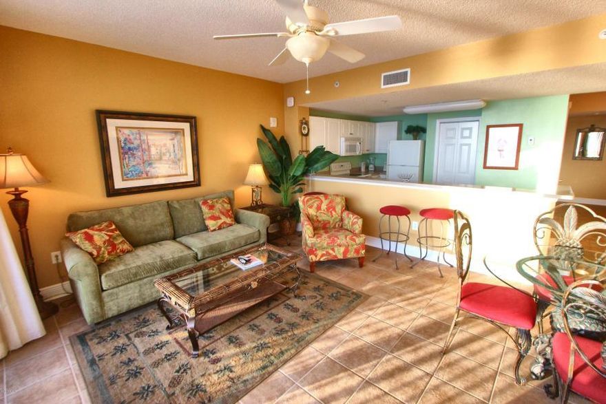 The beach getaway you have always dreamed of - a beach inspired 2/2 Gulf front condo at Majestic Beach Towers. Riveting Gulf views are framed by beachy chic interiors, designed with the Gulf of Mexico and sun in mind. Sunshine and warm gulf breezes abound from the balcony, with amazing water and beach views. The gourmet kitchen features loads of cabinet space and is fully stocked and rental ready and the rest of the condo lives larger than its square footage and is spacious and bright. Tiled flooring in living area! New. Freshly painted!