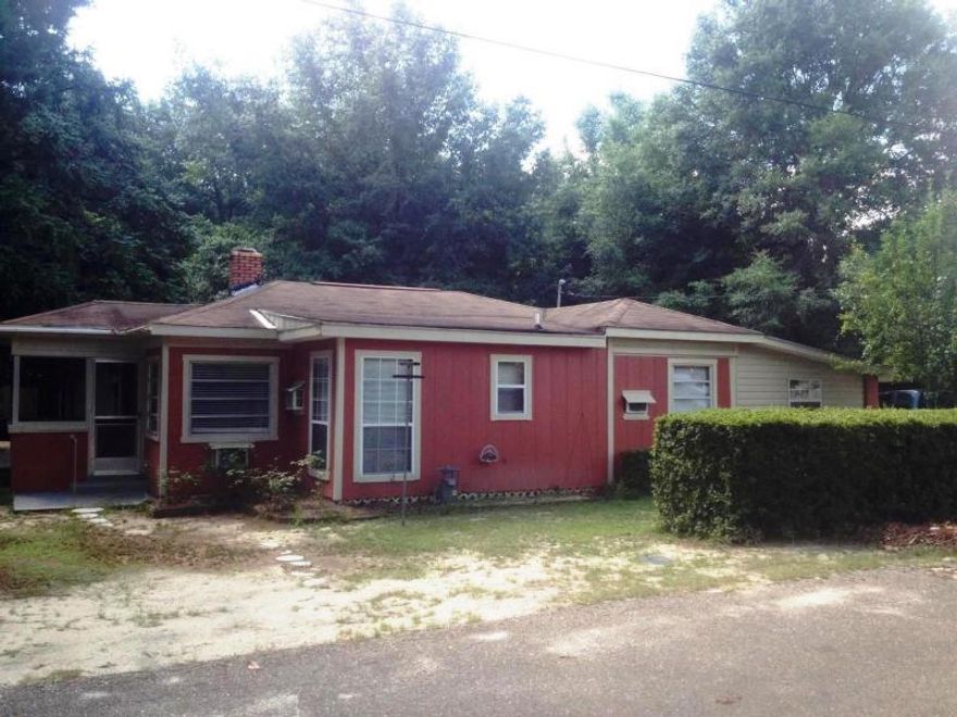 Don't miss this cute home located in the city limits. It features three bedroom and three full baths. It also has a beautiful brick fire place in the living room. There are three out buildings on this property that gives you plenty of storage and entertainment areas.Property to be sold ASIS