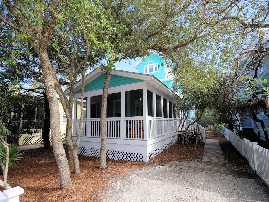 As they say- Location! Location! Location. Only 3 lots in from County Highway 30A, less than a five minute walk to the beach. This traditional Florida beach cottage is the perfect place to spend your family summer vacations. The front screened porch wraps around the side of the cottage and serves as additional outdoor dining. Enjoy your morning coffee as the sun peeps in through the shady oaks. The inside shower is easily accessible from the porch to shower off the daily beach sand. Galley kitchen with tile breakfast bar opens to dining and living area. Covered porch off kitchen overlooks the back yard. First level also features two guest bedrooms with French doors that open on to the porch. Between the bedrooms is a full bath. Master bedroom on second level with full bath and private
