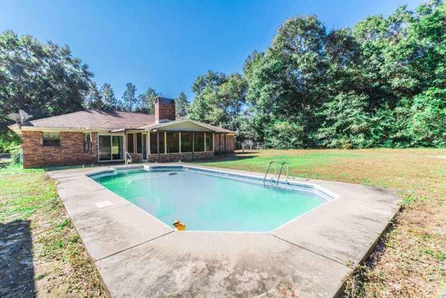 FALL in Love w/ this Solid Brick Home & In-Ground Pool on .55 acre lot.Only 6 min drive to Whiting Field & minutes away from Town of Milton w/ Shopping & Restaurants.Fenced Backyard-NEW ROOF installed JAN 2021- X Large Lv Room open to Dining/Kitchen -New Fixtures/Ceiling Fans -wood burning Fireplace- 2 large sized BDRs-2 BTHs-New Laminate Flooring throughout -Lv Room carpet- Bathrooms= marble tile flooring with Glass Bowl sinks/vanity- Double Glass bowl Vanity in Mstr BTH- Mstr BDR boasts it;s own private patio doors - ALL NEW Kitchen Appliances:  Frigidaire SS Double-Sided Refrigerator, Kitchen Aid Smooth Top Stove, Kitchen Aid SS self clean Oven & Microwave/Convection Oven,Whirlpool SS Dishwasher- New Kitchen hardware/fixtures & Granite Countertops with deep SS Sink, Walk in Pantry
