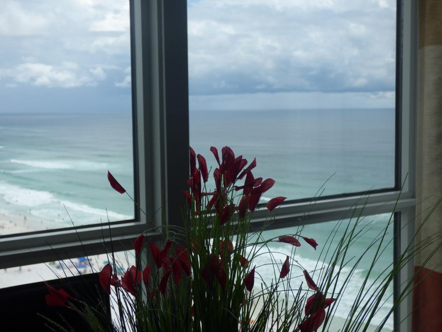 What a fabulous unit on the 16th floor. This large-tiled unit is a star with many updates. Kitchen has new custom cabinets with quartz counter tops and glass back splash. Pendant lighting above the counter in kitchen. All new flip switches. Updated appliances in kitchen and updated washer and dryer. AC was installed May of 2013. New baseboards are 5 1/4. It has custom solar shades in master, living and second bedroom. Built-in cabinets in the second bedroom add a lot of extra storage for owners or guests. Master bath has quartz counter tops and large contemporary sink. Jetted tub has a nice surround and shower has custom fitted glass doors. Hall bath has new shower & custom glass doors. Ceilings in baths & bedrooms have been resurfaced. Turn key with nothing to do. It will not disappoint!