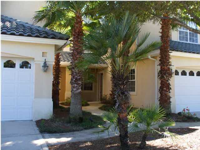 Incredible limited time offer from Sellers - Golf dues at Regatta Bay Golf and Country Club will be paid for 1 year with acceptable Offer!! Regatta Bay, an upscale award-winning golf course community, has it all! The Regatta Bay Golf Villa Condos are proudly owned by both permanent and seasonal residents. What a unique opportunity to purchase a convenient ground floor END unit! Your family and guests will enjoy the putting green located just outside the front door of this unit. Capture the views from the #3 tee box and down the fairway to the green on this championship course. You will enjoy a very serene setting while watching the golfers go for a hole-in-one! This unit offers two (2) screened lanai areas, one for gazing and one for the bar-b-cue located right off the kitchen.