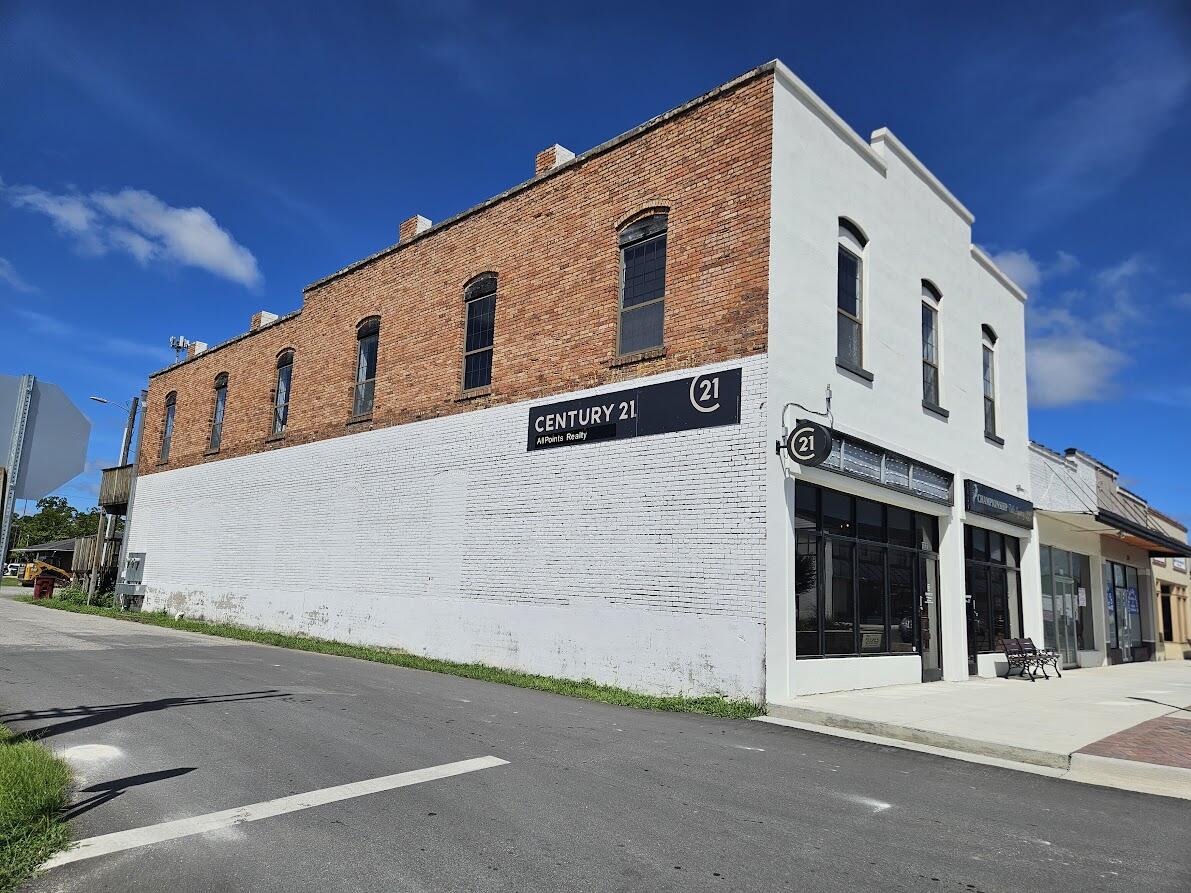 Iconic two-story office building nestled in the heart of Crestview's revitalized Main Street district. The main building on two floors boasts 12 private offices, a welcoming reception area, two break rooms, and two bathrooms, all showcasing original brick and pine finishes. A separate ground floor office space, accessible from Main Street, offers additional flexibility with two private offices, a conference room, break room, and bathroom.This central location provides unparalleled convenience, with easy access to Eglin Air Base and nearby industrial corridors along I-10 and Hwy 90. All information is deemed to be accurate but to be verified by recipients and suitability for intended use.