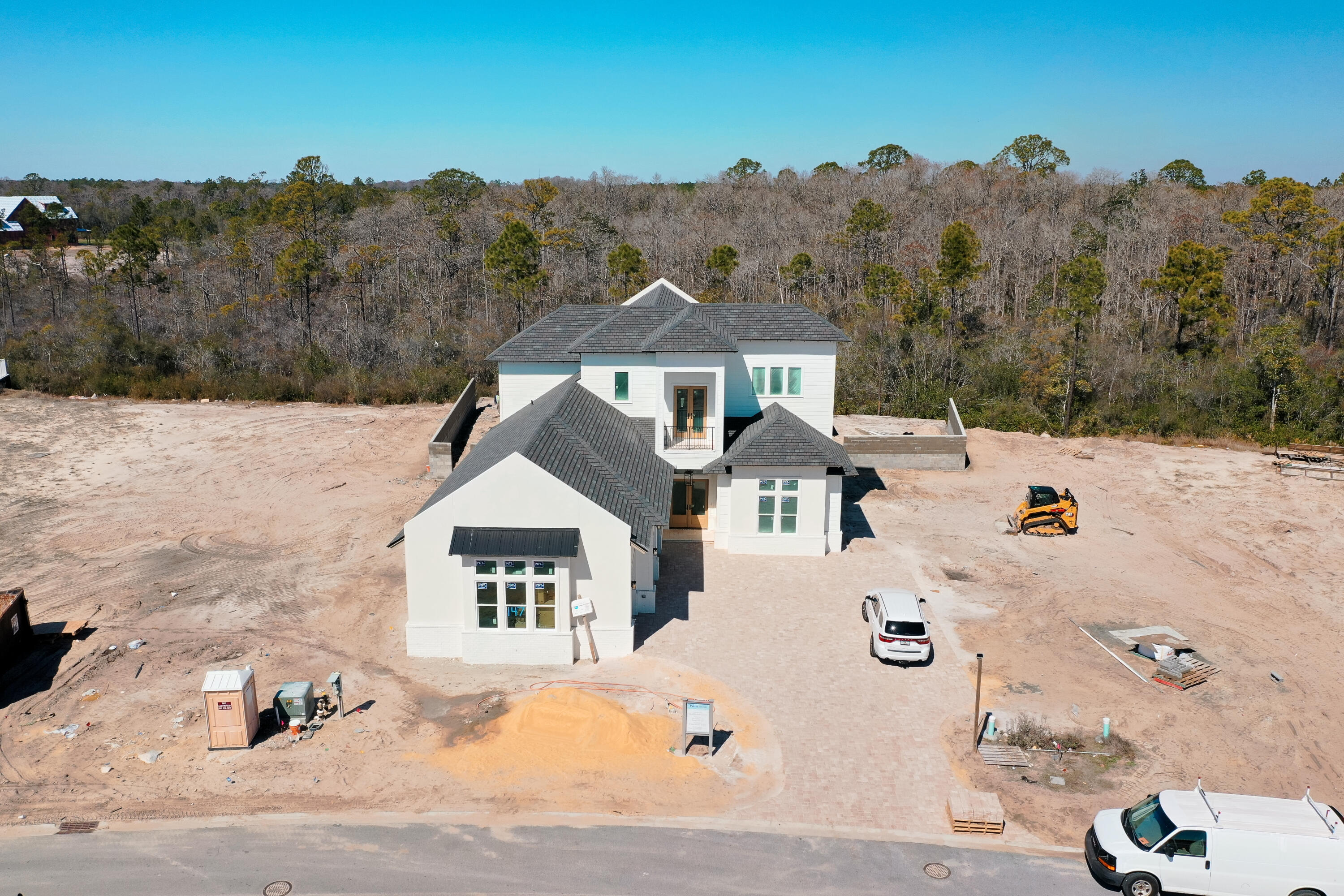 Designed by renowned architect John Williams, this elegant new construction nestled behind the private gates of Camp Creek features impressive craftsmanship with a tasteful coastal flair throughout. A chef's dream, the kitchen encompasses custom milled cabinetry, an oversized island, quartz countertops, and a luxury appliance package with gas range. The expansive living and dining areas are perfectly positioned off the kitchen with direct access to the covered porch with outdoor kitchen effectively blurring the lines between indoors and out while creating a true continuation of living and entertaining space. Strategically positioned, the first level main suite facing the pool is paired with a spa-like ensuite featuring dual vanities and custom tiled wet room. Two additional bedroom suites, each with a dedicated ensuite, complete the first floor. Perched atop the second floor, the breathtaking second-floor main suite is a true oasis featuring a private porch providing the perfect place to enjoy the mesmerizing hues and colors provided by the famed Emerald Coast sunsets each and every night along with a sumptuous ensuite.

147 Quail Hallow comes paired with a WaterSound Clubs Membership providing entry to the acclaimed private beach club along with access to some of the area's best golf courses including Camp Creek, Sharks Tooth, Origins, and the planned Davis Love course. The rental restricted community also enjoys exclusive access to the newly constructed amenity center featuring dual pools, lazy river, pickle ball courts, tennis courts, a wellness center, and an on-site restaurant.

Geographically poised between Scenic Highway 30A and Highway 98, the WaterSound Camp Creek community offers convenient access to the iconic town centers of Alys and Rosemary Beach along with the culmination of world-class dining and entertainment options 30A has to offer.

Located directly across Highway 98, the WaterSound Town Center hosts events like a weekly Farmer's Market and encompasses a Publix, restaurants, a STEAM school learning campus, and medical offices. Inquire today to learn more and discover why WaterSound Camp Creek remains one of the most sought after ownership opportunities along 30A for full-time and second home residents alike.
