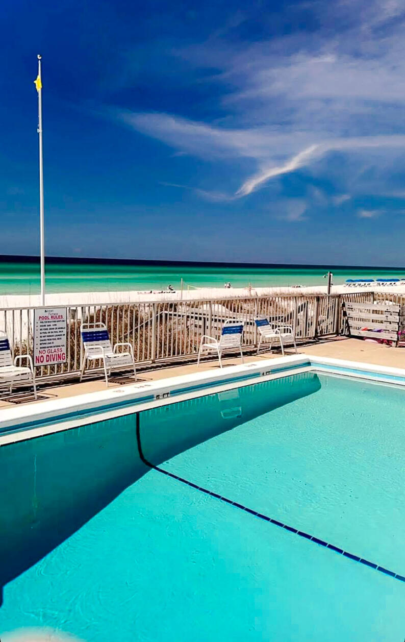 Escape to your own Beach side retreat with this charming condo in Panama City Beach! This cozy unit features a king bed, tile flooring and a beautifully tiled shower. The community offers a pool with direct access to the beach! Whether you are looking for a personal getaway or an investment opportunity, this condo has great short-term rental potential and everything needed for a relaxing stay.