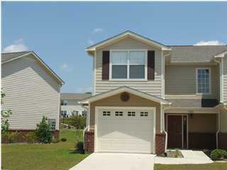 The well developed town home community consists of a nature preservation area with nature trails,a gazebo,and an overlook pavillion. Cool down after a long day at work by the community pool with deck and changing rooms. This location south of I-10 makes for a convenient drive to area beaches and military bases. This is a two story traditional design with brick and Hardy plank exterior. The floor plan has the living and kitchen downstairs and bed rooms up stairs. The garage makes a great way to keep you dry in the rain. Inside the tile floors large molding and whirlpool appliances will be in place for years of service.