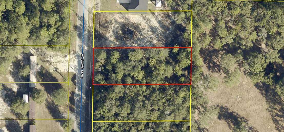 GREAT BUILDABLE LOT! Wooded lot with an 8' privacy fence across the back of the lot. Build your new home or bring your mobile home. Tap fee has been paid and land has been surveyed. Call for a showing today!