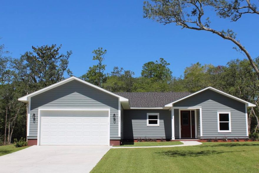 Brand new custom 3 bedroom 2 bath with 2 car attached garage  on 1.39 acres ( almost impossible to find a home site this big today). Plus the subject property includes a  20 x 30 workshop perfect for  anyone who needs his/or her own private workspace detached from the house. The home itself includes granite counter tops through out.  9 foot ceilings. Custom cabinets. Custom lighting.   Black stainless steel appliances including stove, side by side refrigerator, dishwasher & microwave.  The house has  hardy plank siding. Roof construction includes self adhesive secondary roof membrane which is an insurance benefit.   Custom shower in master bath.  Property has been professionally sodded and comes with a top of the line  Rain Bird 5 zone, in ground sprinkler system.  Easy to show.