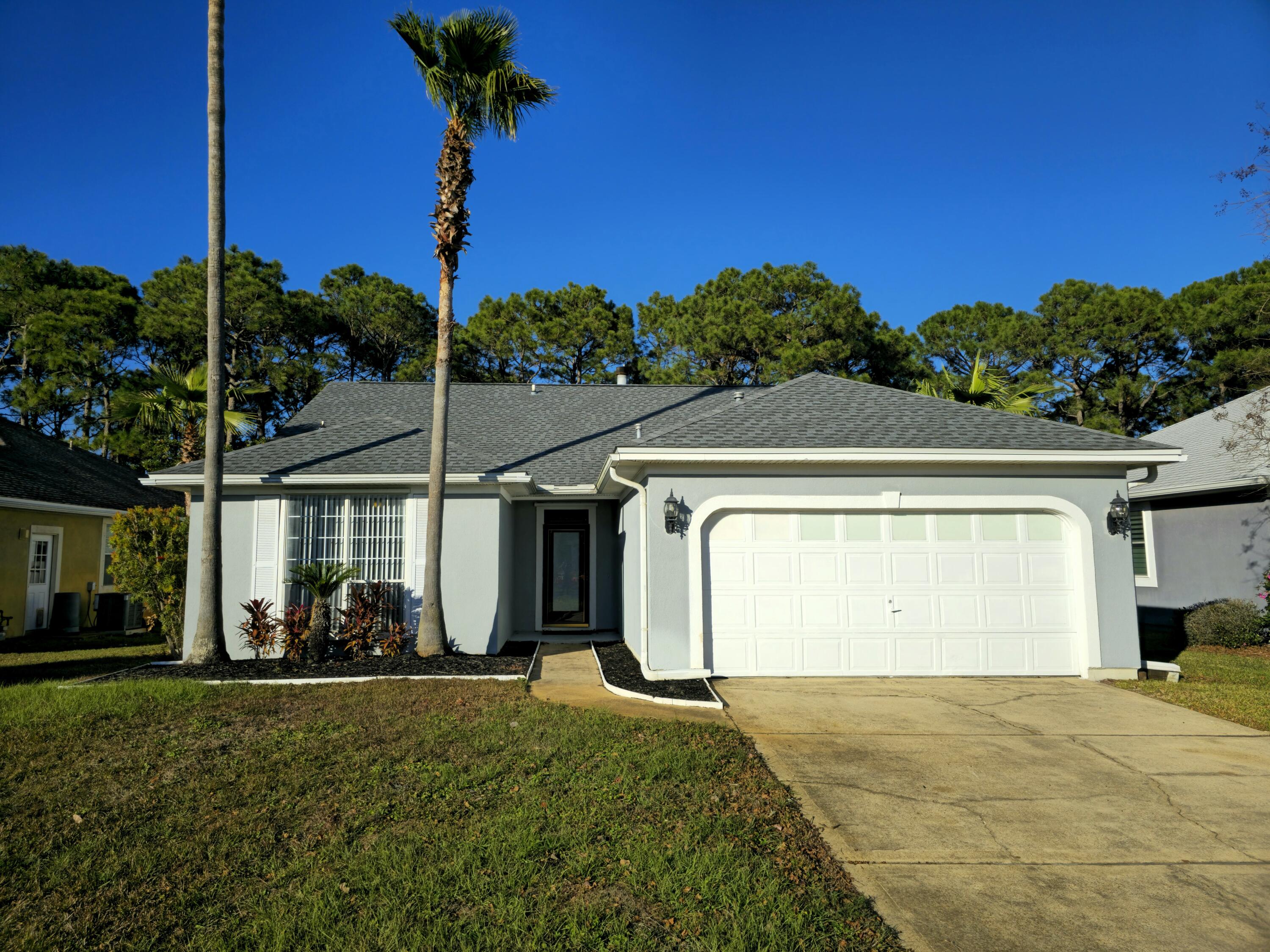 Discover coastal living at its finest with this 3-bedroom, 2-bathroom home in Miramar Beach, just minutes from Highway 98, Silver Sands Premium Outlets, and the white-sand beaches of the Gulf Coast. This home features a spacious living room with a cozy fireplace, a kitchen with ample cabinet space and a breakfast bar, and a private primary suite with dual vanity. Enjoy a fully fenced backyard with an open patio and screened porch. Community amenities include a resort-style pool, tennis courts, a dock, and a park. With its prime location close to shopping, dining, and beach access, this home is perfect for enjoying the Florida lifestyle. Schedule your showing today!