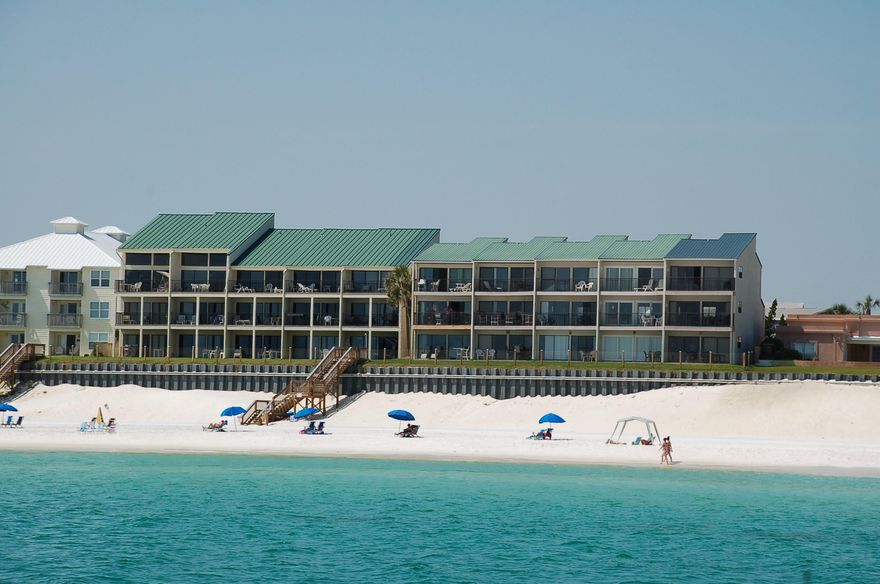 Rare opportunity to own a property in Blue Mountain Villas. This highly sought after building is located on secluded Blue Mountain Rd. If you're looking for a property with positive cash flow then this is it. Over $40,000. in revenue booked in 2015!Blue Mountain Villas 12 hosts an open living area that has full beachfront views of the glistening gulf throughout since a wall of windows frames this blissful scene. Sliding glass doors beckon you out onto the private patio so that along with the dazzling views you may enjoy the lovely sea breeze and listen to the sounds of the soothing surf. The living room is cheerfully decorated in pleasing pastel nautical colors which include the big comfortable couch in blue accented by a creamy love seat beside it. The TV is within a handsome armo