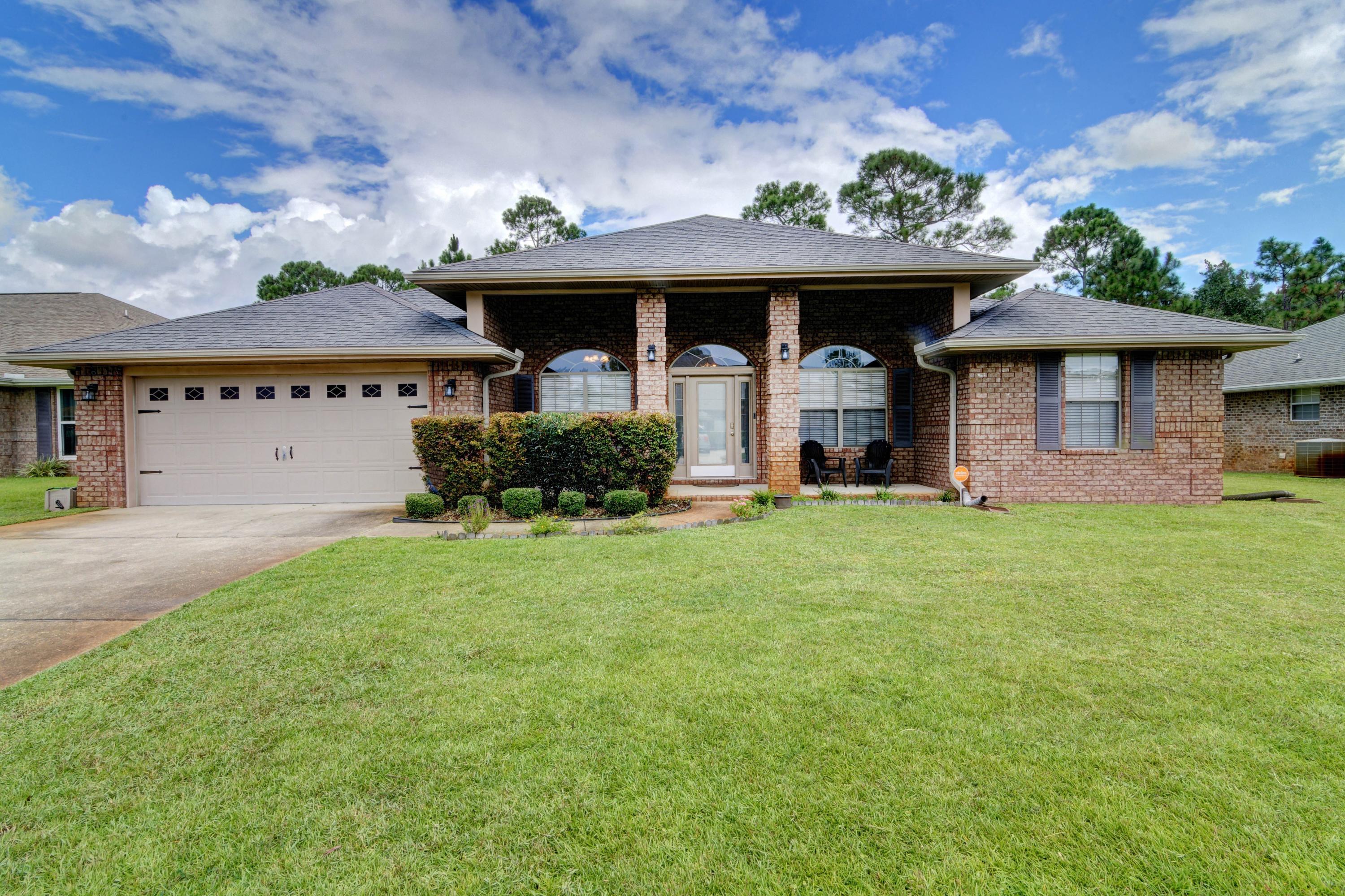 Welcome home to this stunning and updated 4 bedroom east Navarre all brick retreat! Here you'll find all the space you're looking for because in addition to 4 true bedrooms, you'll love that this floor plan features two additional flex rooms on either side of the front door! Perfect for a formal dining room, play room, office, etc - the possibilities are endless! Enjoy updated finishes like bullnose corners, orange peel ceilings, granite counters in the kitchen as well as both bathrooms, and luxury plank flooring! Pull up the front driveway and appreciate the gorgeous landscaping and curb appeal, and take in the expansive front covered patio! Enter inside and you'll find the two flex rooms on either side complete with newly installed luxury vinyl plank flooring that also extends throughout