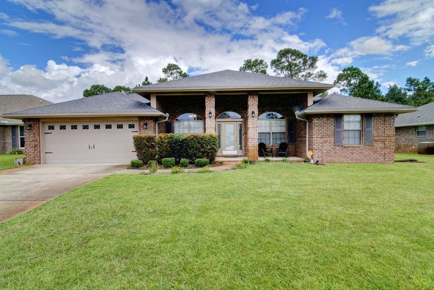 Welcome home to this stunning and updated 4 bedroom east Navarre all brick retreat! Here you'll find all the space you're looking for because in addition to 4 true bedrooms, you'll love that this floor plan features two additional flex rooms on either side of the front door! Perfect for a formal dining room, play room, office, etc - the possibilities are endless! Enjoy updated finishes like bullnose corners, orange peel ceilings, granite counters in the kitchen as well as both bathrooms, and luxury plank flooring! Pull up the front driveway and appreciate the gorgeous landscaping and curb appeal, and take in the expansive front covered patio! Enter inside and you'll find the two flex rooms on either side complete with newly installed luxury vinyl plank flooring that also extends throughout