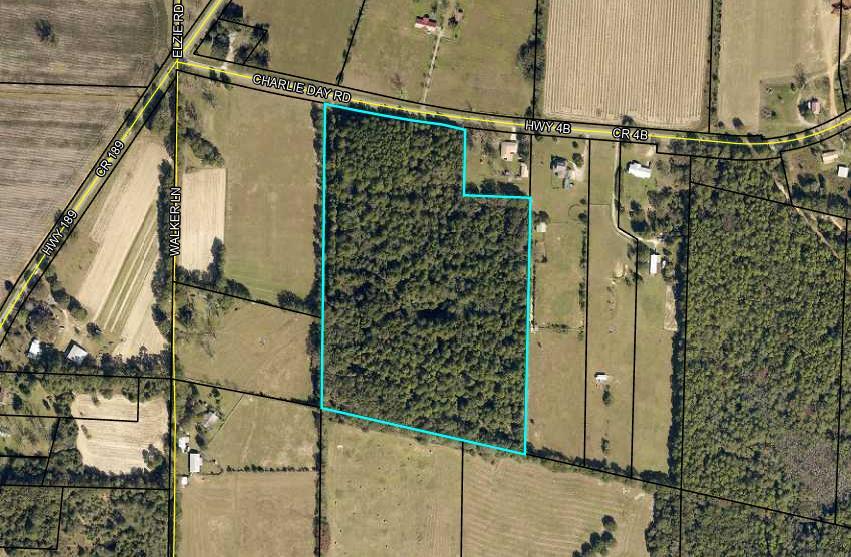 23.66 +/- acres has access to Hwy 4 in Baker and Hwy 90, with beautiful wooded acreage. Under contract accepting back up offers.