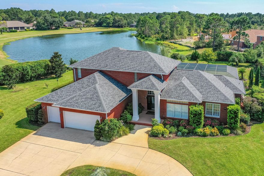 Exquisite saltwater POOL home tucked away in Hidden Creek with stunning views of the lake and manicured golf course. This 5 bedroom, 3.5 bath, 3 car garage offers something for everyone! The circular driveway provides a grand entrance, once inside the home there are vaulted ceilings on the first level, extensive crown molding, Plantation shutters, hardwood floors, recessed lighting, custom paint throughout, and upgraded light fixtures. Just off the foyer is an office to your right which could also be used as a home school space, workout or reading room. Straight off the foyer is a gorgeous open dinging room situated just off the kitchen entrance. The kitchen features white cabinetry, granite counters,