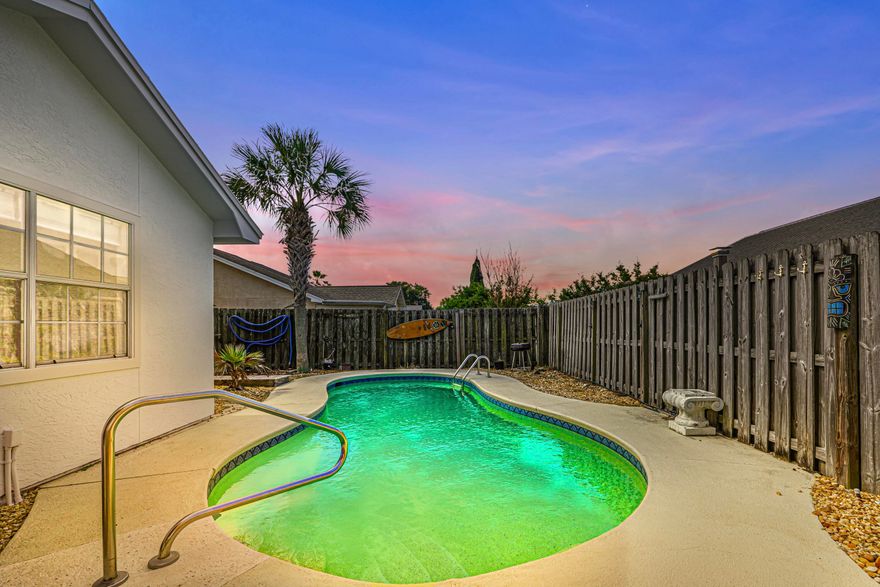 Welcome to your slice of pool paradise in the sought-after Bid-A-Wee & Seaclusion community, celebrated for private beach access and Old-Florida charm. This move-in ready home shines with recent updates: fresh interior paint (2024), bedroom flooring, new water heater, microwave, refrigerator, and HVAC (2022). The roof (2021), exterior paint/stucco (2025), and resurfaced pool (2023) provide peace of mind. Enjoy the sun-filled Florida room with new door (2025) or relax under the sun shade (2024). Outdoors, lush sod, sprinkler system (2024), outdoor shower with heater, storage, and a spacious yard make for perfect coastal living. Minutes to Pier Park, dining, and the gulf, this furnished (excluding living room) retreat is an ideal primary, second home, or investment.