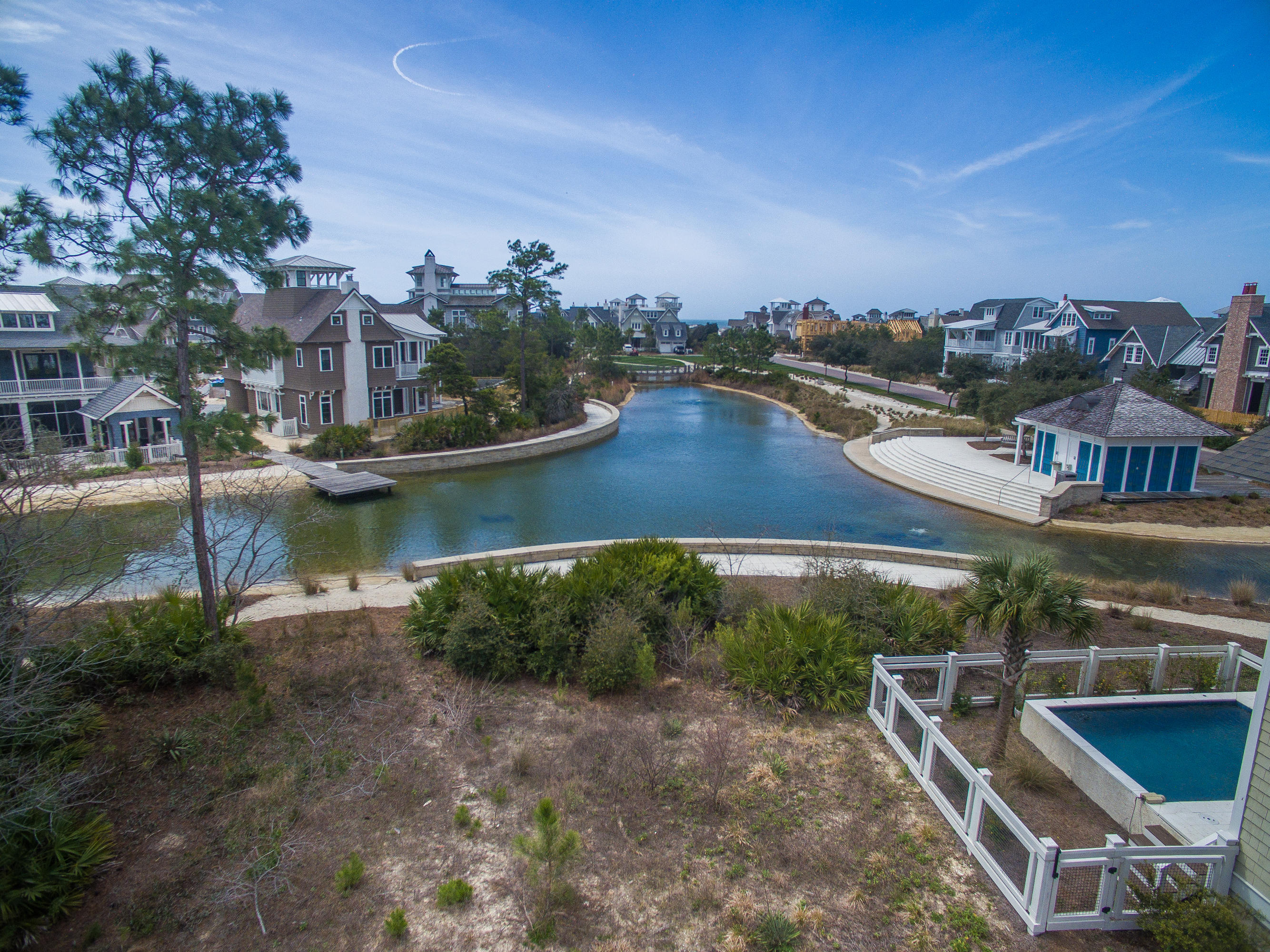 What am amazing opportunity! This special property backs up to the Yacht Pond water feature. This lot faces south and a home will have wonderful lighting. There is great potential for Gulf views from a future home. WaterSound Beach is a gated community with a mile of beach front and 90 acres of rolling dunes. Other amenities include community pools, puttering park, fitness center and miles of boardwalks and footpaths to the beach. Don't miss this special offering!