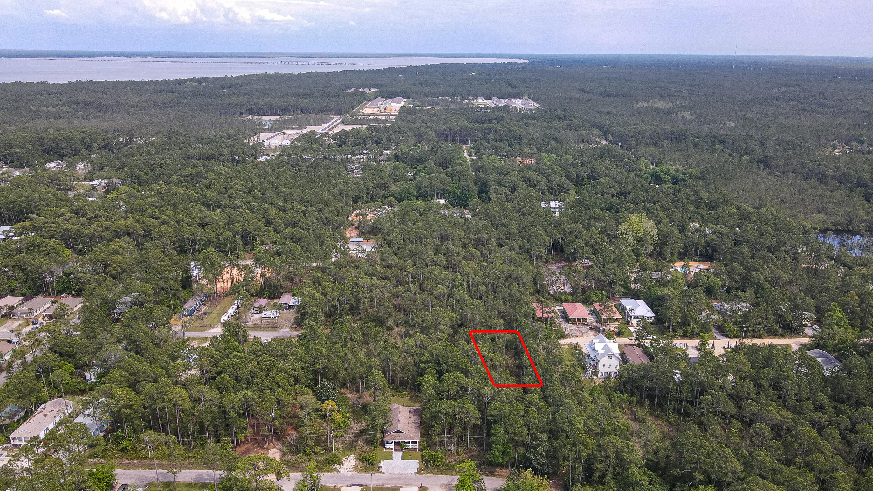 BACK ON THE MARKET! No fault of the sellers! Peace and serenity, 3 miles to the white sandy beaches of 30A, close to Cessna Landing to launch your boat into the Choctawhatee Bay. This lot is perfect for a beach home/second home, primary residence, or an income producing property. Near shopping, restaurants and entertainment of Grand Boulevard, hospital and just minutes to the beach. Are you ready to build your dream home? No HOA. Survey available in Documents
