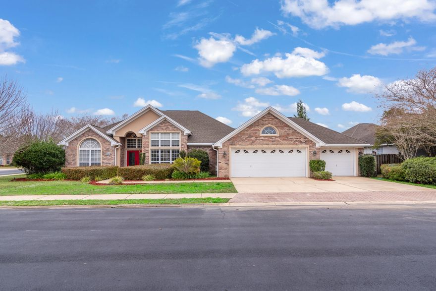 Don't miss the chance to own in this highly sought-after gated community! Step into the foyer and be greeted by high ceilings and sweeping archways. Tile floors throughout this open floorplan. The spacious living area includes a gas fireplace with custom tile inlay, and the hearth even has drawers for storage! Chef's kitchen is immaculate with upgraded stainless appliances, granite countertops, and a large breakfast bar. Large master suite with bamboo flooring and a sitting area. Master bath has double vanities, large garden tub, huge walk-in closet, and a separate walk-in shower with double shower heads. Split floorplan and extra insulation to reduce noise ensures maximum privacy. Hall bath has a step in shower and large vanity with granite countertop. Step out to the covered patio and