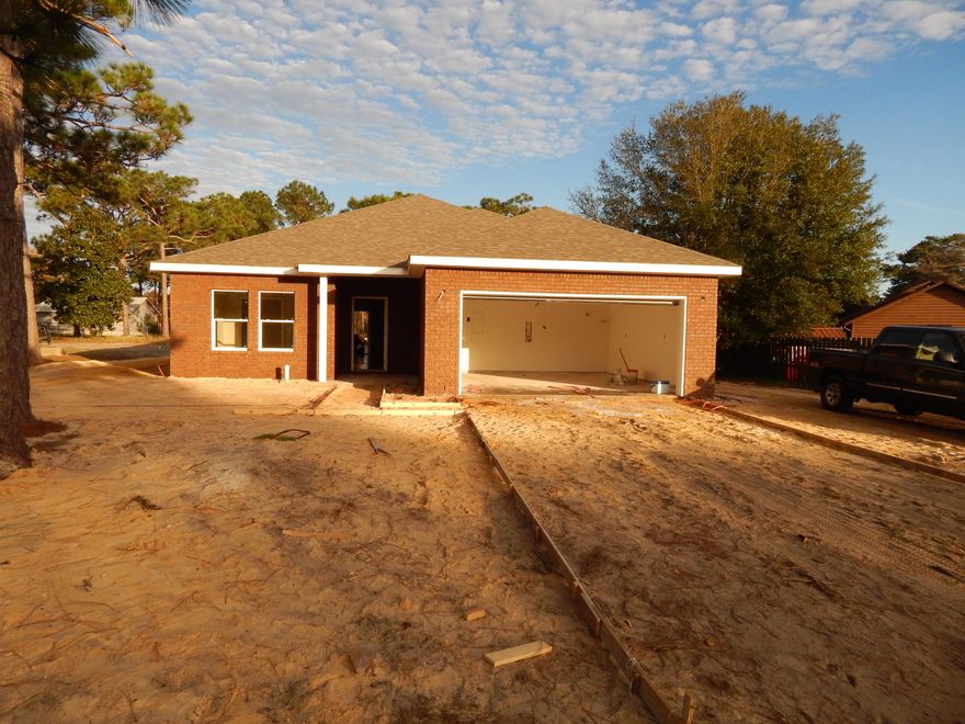 ONE OF THREE HOMES UNDER CONSTRUCTION NOW!(see MLS 740132 and 740136.) Buying New saves $$$ on utilities and insurance! Located In the zone for 100% USDA Financing! Builder pays nearly all closing costs with a full price offer and approved lender. See details in agent notes. Close to Bases, Beaches and Shopping! This Affordable BRAND NEW HOME is on nearly 1/2 of an acre (.42) & will be completed in early 2016. Loaded w/Extras! This 4 Bedroom/2 Bath Home has an Open Concept Floor-Plan! (See pictures) Amenities include: Granite Countertops in Kitchen, Raised Breakfast Bar, Pantry, Wood Cabinets, Upgraded Fixtures, 17x6 Covered Porch/Lanai, tile in foyer, kitchen, baths and Laundry Room. Master Bedroom is nicely sized. Master Bath will have a Tub-Shower Combo, LARGE Walk-in Closet