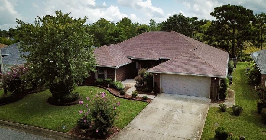 GREAT LOCATION! Creetwood Village is  approximately 8 miles west of Hurlburt Field and minutes from the beach. Beautiful all brick %4 bedroom 3 bathrooms, separate shower in master, study, formal dining room, large covered patio for summer fun and fenced yard. Kitchen has granite countertops, an island that overlooks the family and underground utilities.  New LVP flooring and freshly painted.