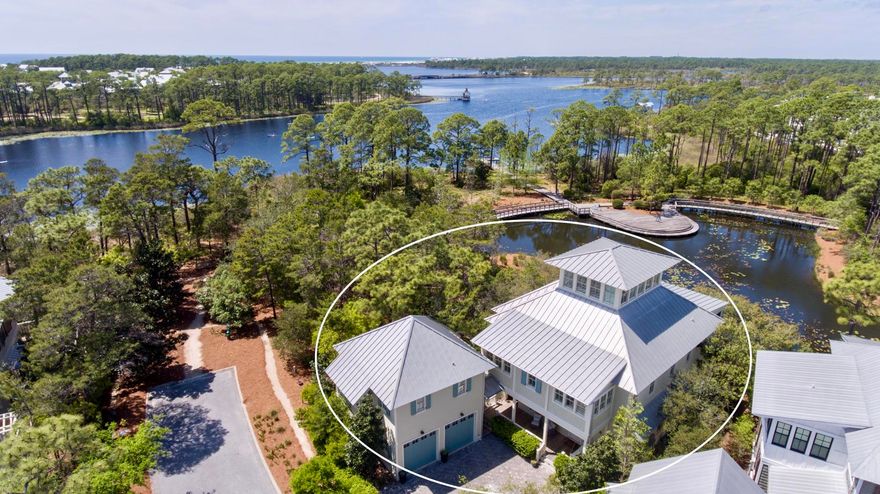 Imagine sitting on your oversized screened porch watching a beautiful sunset over Western Lake and the Gulf of Mexico with your family and friends. This house offers it all; multiple gatherings spots, an elevator to the second floor, an open kitchen and family room, and a tower to get the best view of the water from Cove Hollow. Designation for Fortified for Existing Homes Hurricane Resistance which will reduce your insurance. In addition to all this the house offers an outdoor fireplace where you have a private view of one of WaterColors most coveted ponds, a whole house generator, a separate carriage house, a security system that includes cameras that can be viewed anywhere in the world via your mobile phone. To top it off this home has hardwoods throughout, a Star Power...SEE MORE...