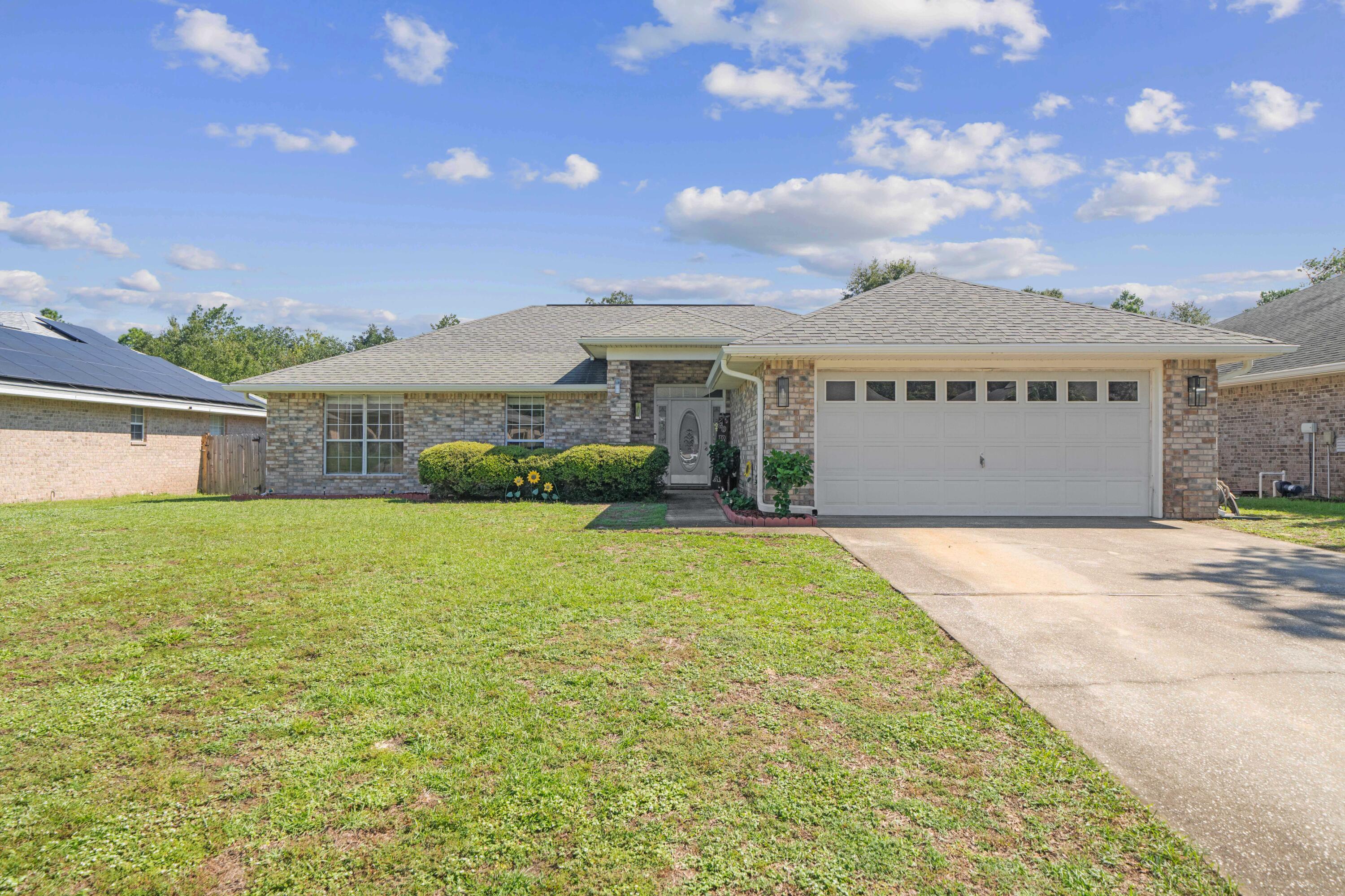 Welcome to Tom Kings Bayou. You will enjoy this beautifully kept home with large a backyard and creek-side living. This 3 bedroom/ 2 bath home includes a spacious bonus room. The master suite features plenty of light, views of the creek, and ensuite bath. The master bath is completed with double vanity, oversized soaking, walk-in shower, and a large walk-in closet. As you head outside, you will find a brand-new deck overlooking your spacious backyard and access to your own private beach on Tom Kings Bayou creek. Sit by the fire pit and enjoy the sounds of nature. This home is complete with full privacy fence, new irrigation system, and new gutters.  It's just a short distance to Military Bases and all that the Emerald Coast has to offer.  Call to schedule your tour today.  Motivated Selle