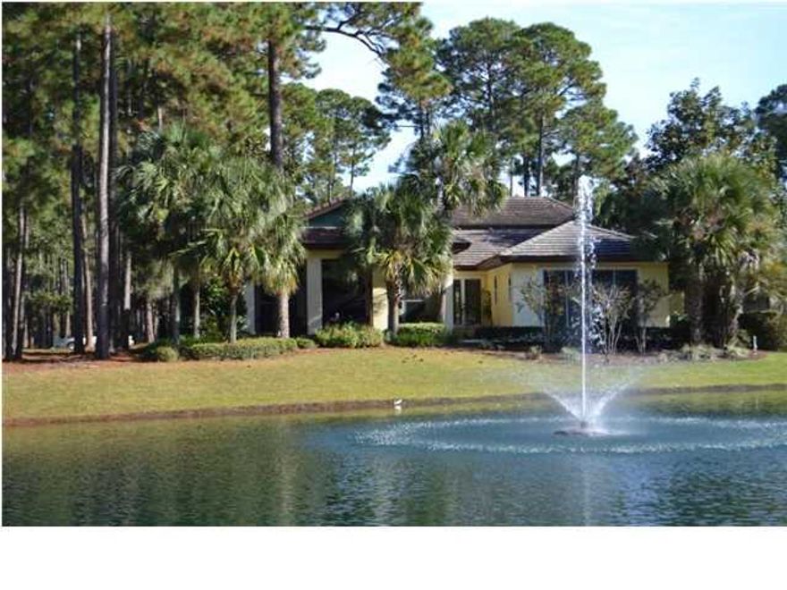 IDEAL HOME FOR THE EMPTY NESTER - 2 EXTRAORDINARY SEPARATE LIVING AREAS UNDER ROOF - PERFECT FOR THE LIVE IN PARENT, VISITING FAMILY OR GUESTS! This 4BR/3.5BA home offers heated & lighted pool with regal lagoon finish & raised coping, a large luxurious courtyard with mature landscaping, outdoor shower and herb garden, lake views, and privacy. MAIN LIVING QUARTERS as follows: LARGE KITCHEN features double door entry, views of courtyard and heated pool, granite countertops, built in ice maker, roll out storage, Dacor appliances including stainless double ovens, chef's 6 burner gas cook top, built-in stainless microwave, side by side refrigerator/freezer with matching wood accents, oversized triangular granite island includes micro refrigerator [or wine cooler] & stainless sink, cust