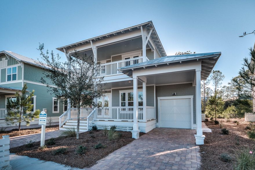 This Sandcastle home is a beauty and Move In Ready!! Come see this home today. 3 bedroom, 4 -1/2 bath home plus loft (could easily be a 4 bedroom) has an attached garage and carport! Wonderful floor plan with spacious 1st floor owner's suite and expansive closet. Living room with fireplace is open to kitchen and breakfast room. Upstairs you will find two additional owner's suites plus another suite- that's 3 owner's suites total and a loft! Outdoor living and porches galore on this home with 4 covered porches- 2 overlooking preserve! Wood floors throughout the whole house, outdoor showers, impact resistant windows/ doors, and 2 x 6 exterior framing are just a few of the things we do differently than other area builders. Location close to the pool and new Phase 2 amenities including close proximity to the Sunset Pond make the location of this home ideal! This ultimate walkabout community has a prime location near 30A in addition to providing residents with the amenity-rich Gathering Place- complete with heated lap pool, hot tub, zero entry pool, firepit, grills, and much more! Newly added amenities include trails throughout, Energi fitness stations, multi-purpose court, pickelball court, and more green space. NatureWalk has a seasonal beach shuttle running to and from the beach and Seaside! We are open 7 days a week, come check out this home and our 3 designer decorated models.
