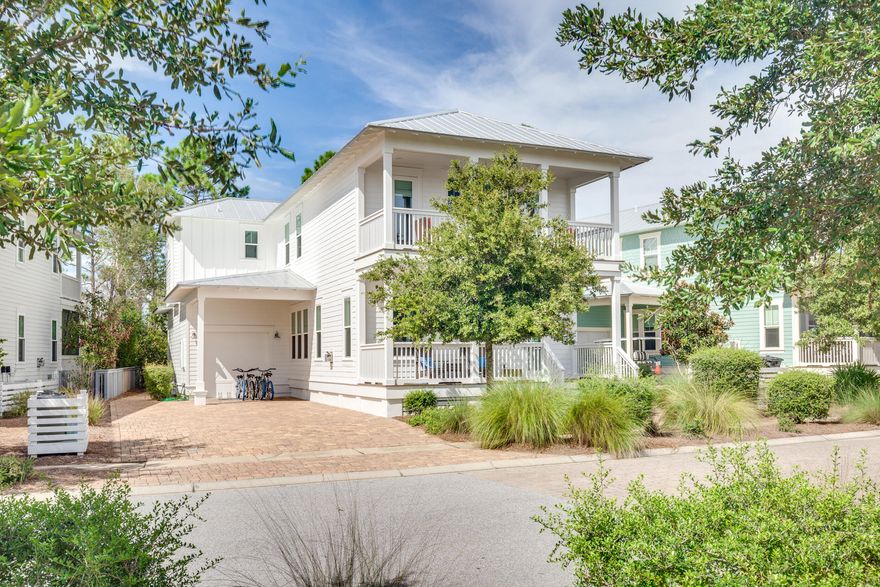 Welcome to the Emerald Jewel, this very well cared for cottage is located in a prime location, just 3 houses down from the community pool and steps to the path to the beach!  Since January 2021 this home has done $124k in rental income.  CDD Bond is paid off= lower taxes. This pie shaped lot allows for lots of parking in the driveway and also carport and extended garage. This cozy beach cottage welcomes & calms you as soon as you walk in the front door with neutral colors and impeccable finishes. Living room offers a gas fireplace with shellstone tile surround and white beams with crown moulding. There's plenty of room to relax with your loved ones.