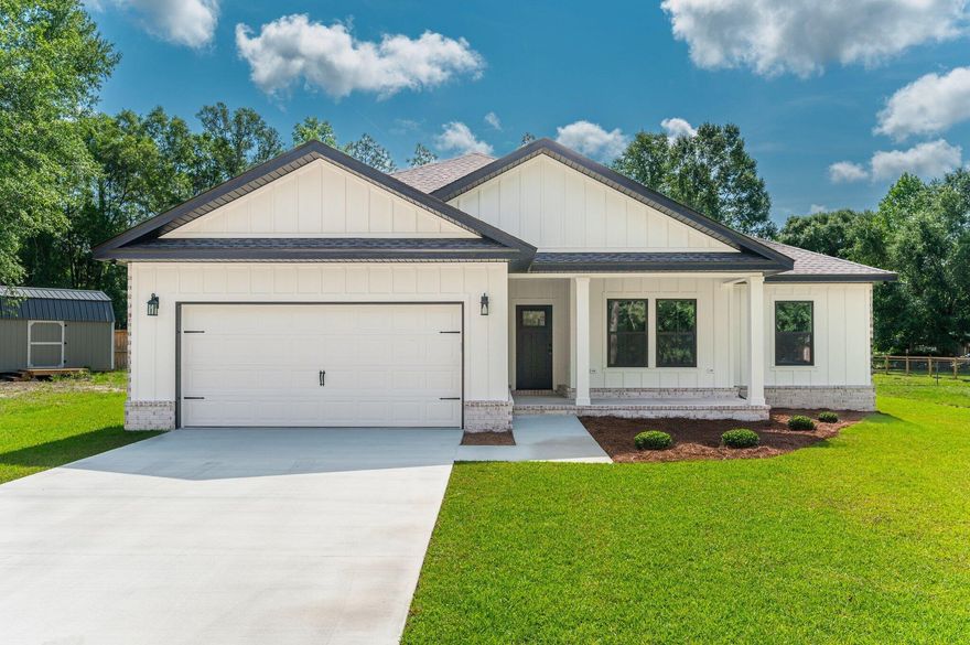BUILDER PAYS CLOSING COSTS/RATE BUY-DOWN UP TO $15K!! Presenting this beautifully crafted new construction by Award Winning Parade of Homes Builder of proven quality homes time and again. Situated on a 1/3 acre level lot, this home boasts many upgrades that set it apart from the others. Beautiful Avondale brick on 3 sides w/ a combination of hardi and brick on the front and painted columns. Impact windows on the front and foam insulation in the roof bibs and in the walls. Front porch and front foyer entry are very inviting! Spacious open floor plan w/ LVP flooring, neutral colors and recessed lighting throughout. Kitchen boasts quality cabinetry w/ soft close doors and drawers, quartz countertops, oversized island w/ farm sink, pendant lighting and custom floating wooden shelves in pantry. Master suite is spacious and features dual vanity, large custom tiled shower w/ herringbone mosaic shower floor and walk-in closet. Nice sized laundry and gorgeous mud bench custom built w/ stained accent seat. Covered back porch and nice cleared back yard. Superb location w/ respect to amenities! Located within a mile of Publix Northcrest, postal office and banks w/ schools, restaurants, etc.. with 1-2 miles as well - convenience yet tucked away off the main roads. 1 year builder warranty. NO HOA and located in the county which means lower property taxes! Estimated Date of completion is mid May! 