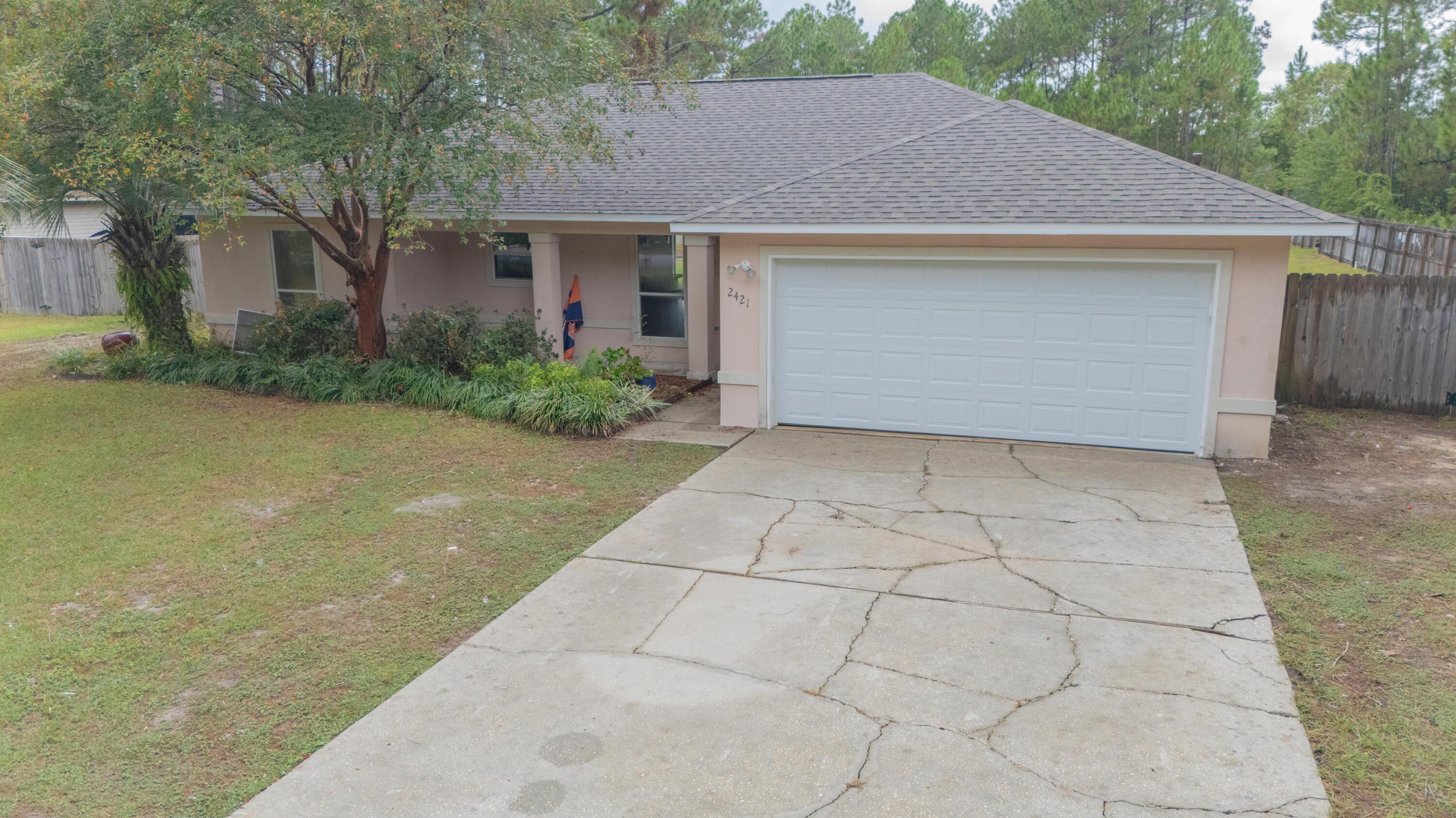 This 3-bedroom, 2-bath home in Holley by the Sea offers 1,436 sqft of living space on a half-acre lot just 4 miles from Navarre Beach. The split floor plan offers privacy, while the freshly painted living area seamlessly transitions into the updated kitchen, featuring granite countertops, quiet-close cabinetry, and an open layout designed for everyday living.Upgrades include a brand-new roof with hurricane clips, a new garage door, and recently replaced major systems (HVAC and water heater in 2019). The 2-car garage and over half-acre lot add both storage and room to grow.Enjoy the Florida lifestyle outdoors with a heated saltwater pool (2019) and a large pergola (2021) perfect for entertaining. An 800 sq ft concrete pad provides options for a storage shed, workshop, or guest spac This 3-bedroom, 2-bath home in Holley by the Sea offers 1,436 sqft of living space on a half-acre lot just 4 miles from Navarre Beach. The split floor plan offers privacy, while the freshly painted living area seamlessly transitions into the updated kitchen, featuring granite countertops, quiet-close cabinetry, and an open layout designed for everyday living.
Upgrades include a brand-new roof with hurricane clips, a new garage door, and recently replaced major systems (HVAC and water heater in 2019). The 2-car garage and over half-acre lot add both storage and room to grow.
Enjoy the Florida lifestyle outdoors with a heated saltwater pool (2019) and a large pergola (2021) perfect for entertaining. An 800 sq ft concrete pad provides options for a storage shed, workshop, or guest space. Holley by the Sea amenities include pools, tennis courts, a gym, and private water access.