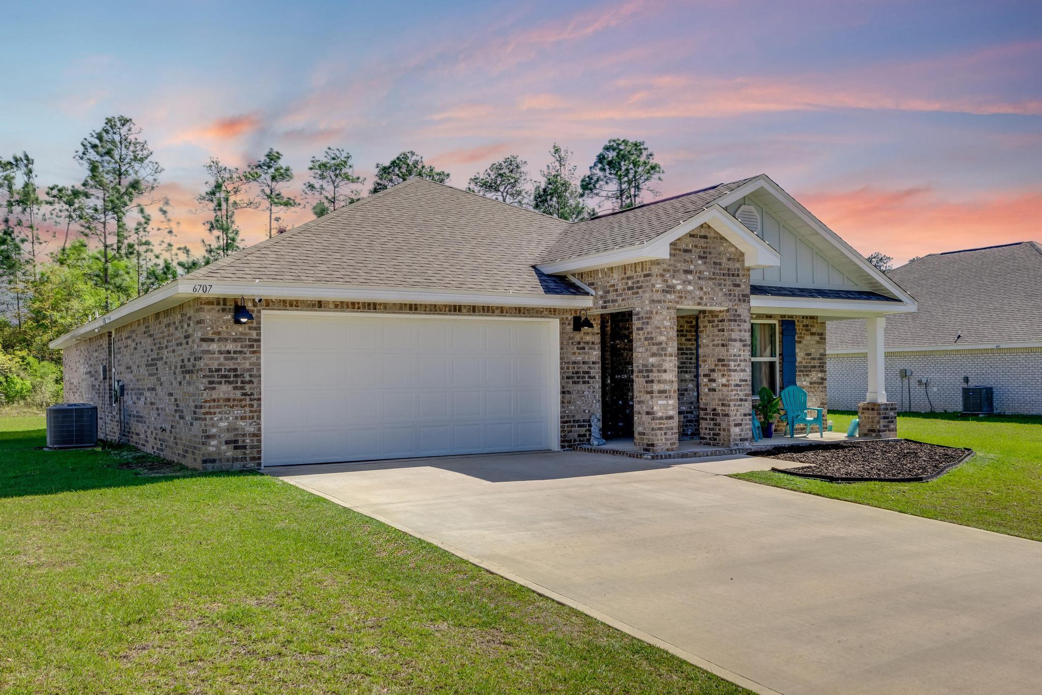 Very pretty ''ALL BRICK'' home situated on large peaceful lot in a in a country, wooded setting is just waiting for you! This home stuns with beautiful kitchen features with a large island bar for extra seating, stainless steel appliances and a totally open floor plan, built in microwave, smooth-top range, dishwasher, pantry & nice open dining area that leads out to the screened in covered patio. IT'S LOVELY!! The first bedroom has an adjoining bath which features a large walk-in closet, double sink vanity & a large shower while the master bedroom can easily accommodate a king size bed.This beautiful home also comes with awesome wood look flooring plus a sprinkler system & the great thing about this subdivision is that it has has underground utilities and sidewalks. Call now!