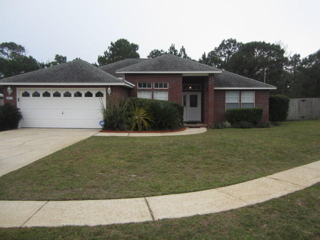 Coveniently located all brick home on cul de sac and only 7 miles from Hurlburt AFB. This home boasts cathedral ceilings, formal dining room, firplace, gas range, breakfast bar, tiled kitchen and utility room. The master bath has a garden tub, seperate shower and walk in closet. Large fenced back yard. You are also close to Navarre town center and Navarre Beach. Call to make an appointment today. Sorry no pets are allowed