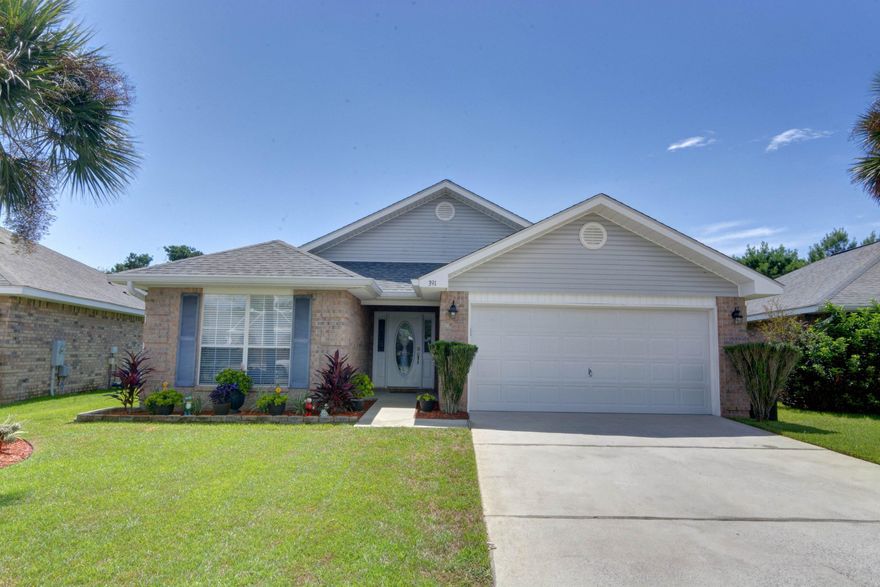 Beautiful large home in great neighborhood of Paradise Retreat. Walk to the Beach, shopping, restaurants. Most sought after floor plan in the community. A true split plan. Huge Master Suite with his and her walk in closets, private owners bath with double vanity, separate shower and garden soaking tub. The living room has vaulted ceilings creating an open, comfortable feeling. Large eat in kitchen that opens to the family room overlooking the wood deck, hot tub and lush landscape. Very private back yard with fruit trees; pear, persimmons, kumquat and lime. Yum! Separate dining room or it could be used any way you create it. The living room and dining room could be a very lovely living area. The owner has added planked tile flooring, except for bedrooms which are carpeted. Upgraded Samsung kitchen appliances, Samsung washer/dryer, front loaded with storage stands, air conditioner with 3 years remaining on warranty with parts and labor, annual service (twice a year), recess lighting throughout, not including bedrooms, upgraded dimmer switches, new lawn pump, new upgraded garage door opener, fully operational Marquis 200 gallon hot tub with customer wood decking across the back of the home, beautiful Pergola, and Weber gas grill with propane.  This home is immaculate!!!! You won't be disappointed.