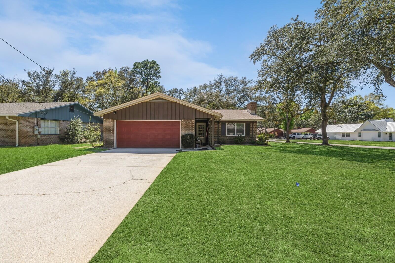 The seller is sweetening the deal by offering $5,000 ''any way'' money with an acceptable offer! Don't let the opportunity to own this well-maintained home nestled in the heart of Niceville slip through your fingers! Situated on a corner lot surrounded by mature trees, this charming brick 3-bedroom, 2-bathroom home has what you're looking for.As you approach, the unique front door adds a touch of character, inviting you into the cozy open-concept living and dining areas complete with fireplace. Most of the furniture, electronics, linens, some tools, as well as many garage and shed items, can be included in the sale (excluding the dining table). This will making moving in a breeze!