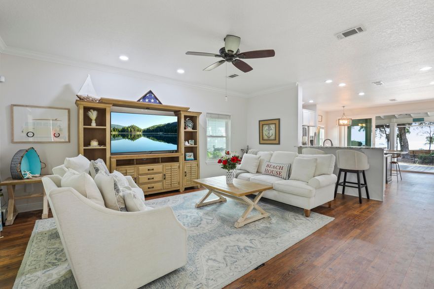 Waterfront Lifestyle on the Bay offers Sweeping views of the clean blue water off Mack Bayou. Nestled in Sacred Oaks, a neighborhood that lives up to its name with grand oak trees draped in southern moss, this enclave Located near the upscale Grand Boulevard shops and the iconic white sands of Florida's Scenic Emerald Coast Highway 30A.This beautifully maintained 3-bedroom, 2.5-bath home provides an open living, dining, and kitchen design while highlighting the stunning water backdrop. The glider window opens to a screened porch and brick paver patio ready with a fire pit for smores. This home is perfect for watching dolphins, coastal birds, spectacular sunsets, and sunrises.Enjoy watersports right from your backyard. Adjacent to your backyard is a boat launch to enjoy paddleboa rding, fishing, canoeing, or mooring your own boat and exploring the bay. One home site away is a large boat dock for owners to enjoy.

With fresh paint, updated kitchen, and your own tranquil water view home, you may create a move-in-ready paradise! There are endless views from this home, including water views from your primary bedroom! Located on a quiet cul-de-sac with a reasonable HOA.

This pet-friendly community is a short golf cart ride to dining, entertainment, neighborhood trails, Publix, and ample beaches near. There is also easy access to three nearby airports.

Whether savoring morning coffee on the porch or relaxing by the fire pit at day's end, this property delivers a rare combination of natural beauty, privacy, and convenience. A one-year home warranty adds peace of mind.

The neighborhood is north of Hwy 98 and about 3 miles to the nearest white sand and clear water beaches. Away from traffic and noise while also minutes from the popular Bay Town Warf, Grande Shopps, outlets. and so much more.

The Sacred Oaks covenants do not allow short term Rentals as the community is a tranquil water front community. This perfect beach house is awaiting your new family memories.
