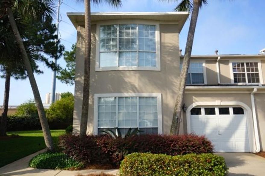 Must See to Appreciate this newly Renovated 3 Bedroom, 2 Bath town home featuring Upscale Decor throughout the Open Floor Plan. 18 foot ceilings, ''Hardwood look'' Porcelain Tile Floors in Living & Dining Areas, Gas Fireplace, Kitchen with Granite Countertops & Bar, Stainless Steel Appliances & designer lighting are just a few of the features. Dining Room French doors open to screened back porch that overlooks the lawn. Spacious Master Bedroom & Bath on 1st floor. Upstairs are 2 large Guest Bedrooms, Guest Bath with Skylight, & a Sitting Area. HOA takes care of the large yard, landscaping & exterior maintenance. Bon Villas, located in the Bayside Community, offers a Bayfront Dock and Fishing Pier, Recreation area with picnic table, Covered Pavilion, Bon Villa Pool, Bayside Pool, Tennis